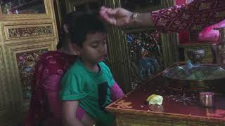 Buddhi Maya Tamang, Aama Bompo conducts divination and a healing ritual on a baby boy.