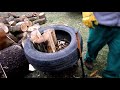 Hand splitting firewood using a tire