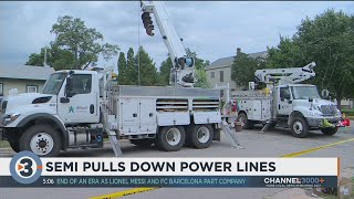 Semi-truck pulls down power lines in Monroe, knocking out power