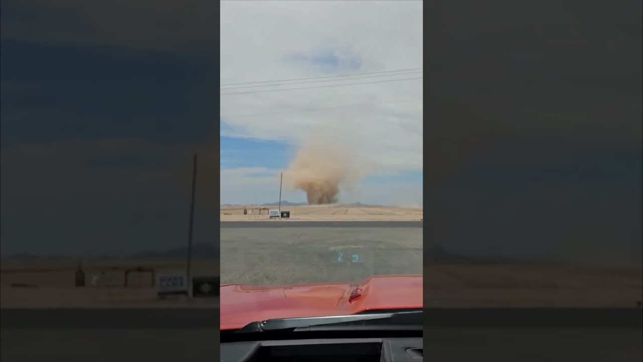 Multi-Vortex Dust Devil Crosses Desert Roadway