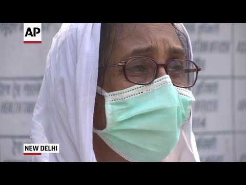 Hurried funerals as India's virus cases climb