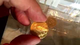 Large box containing small gold coins Indian head 5 and Liberty 10