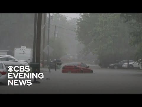 Flash floods swamp South as heat threat persists