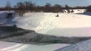 Snowmobile and river
