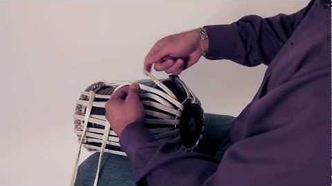 TransTabla lacing, tying off buckle, centering base ring