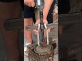 jaw bearing puller, also known as a pulley or gear puller, being used to remove a component shaf