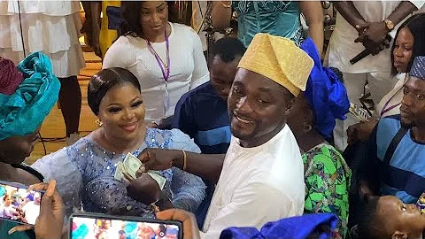 ADENIYI JOHNSON RAINED STACKS OF DOLLARS ON HIS WIFE SEYI EDUN AT THEIR NAMING CEREMONY PARTY