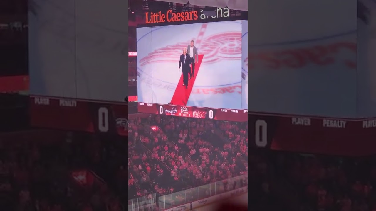 Larkin and Ovechkin Shake Hands After the Ceremonial Puck Drop by Scotty Bowman and Mike Vernon