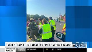 Two people entrapped in car after single car crash