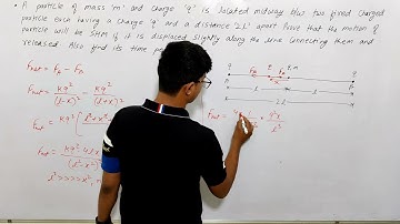 A particle of mass m and charge q is located midway between two fixed charged particles each......