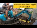 Chinese Alibaba mini digger at work again - digging footings and a lucky topple over