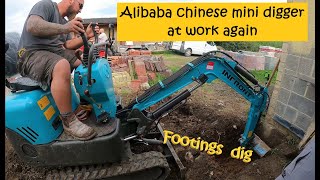 Chinese Alibaba mini digger at work again  digging footings and a lucky topple over