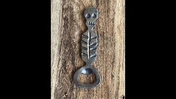 Blacksmith Forging A Skeleton Bottle Opener