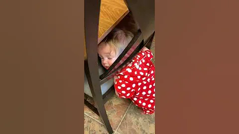 Toddler gets her head stuck in a chair