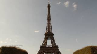 4K Wide Angle Shot of Eiffel Tower with clouds tilting up time lapse 4096x2304 UHD Cinema4K