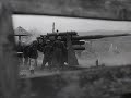 88mm flak guns engage soviet targets on land and at sea on the kerch peninsula in may 1942