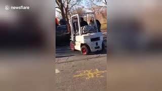 Forklift driver in rescue attempt after car flips in New York