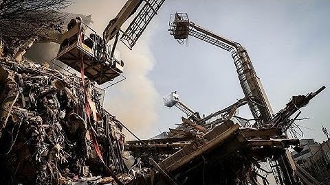 Tehran building collapse: search for dozens of missing firefighters