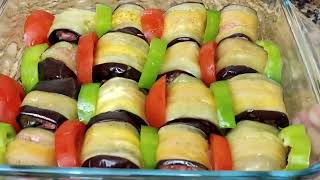 Eggplant rolls with minced meat in sweet and sour sauce.