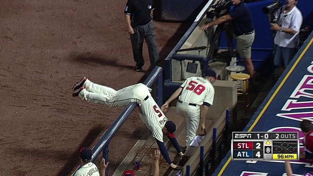 Freeman reaches over dugout rail, makes grab - YouTube