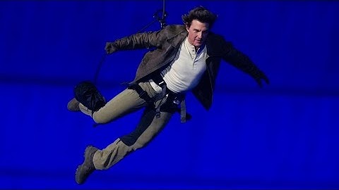 Tom Cruise descends from stadium roof in daring Olympic finale