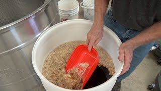 Separating over 120 pounds of honey from our wax cappings.