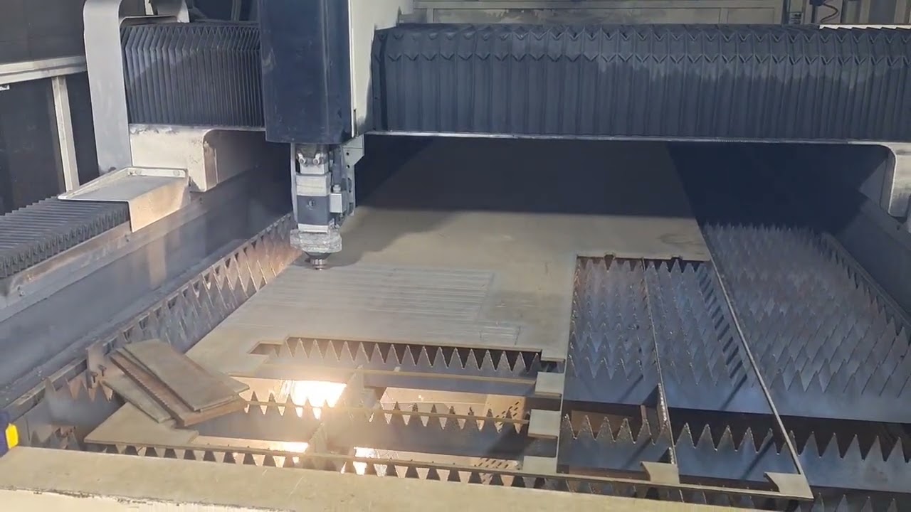 Titanium alloy plate is being processed by  laser cutting