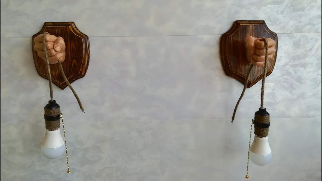 Светильники   человеческие руки.