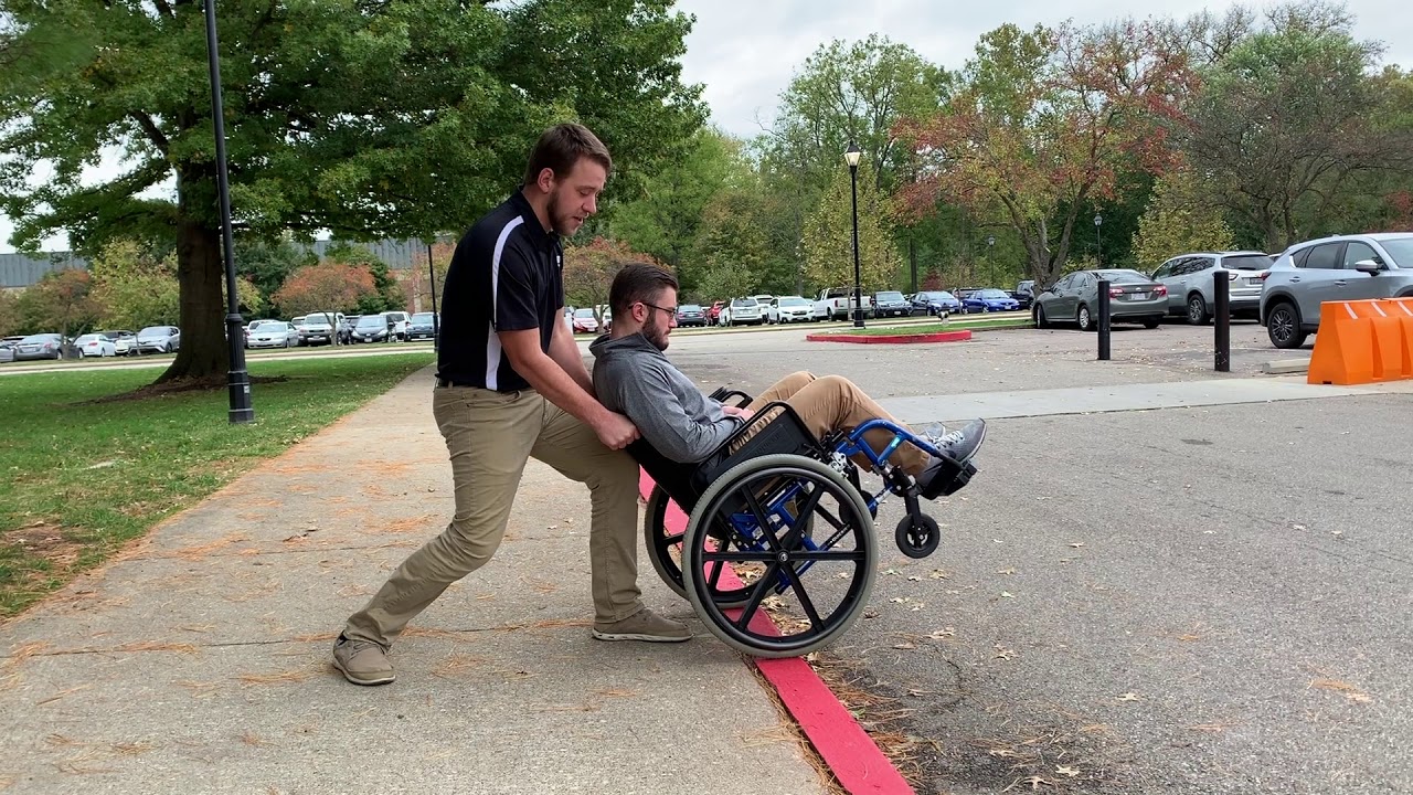 Skill 19_Wheelchair up and down curb - YouTube