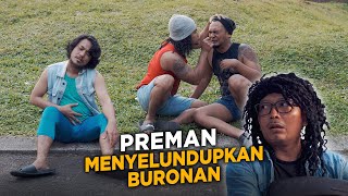 PREMAN MENYELUNDUPKAN BURONAN