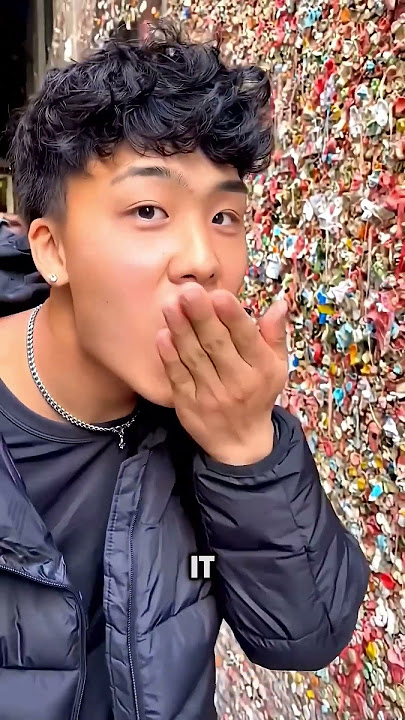 This guy is licking the world oldest gum wall