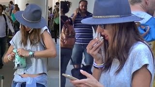 Alessandra Ambrosio Makes Eating Popcorn Look Sexy At LAX