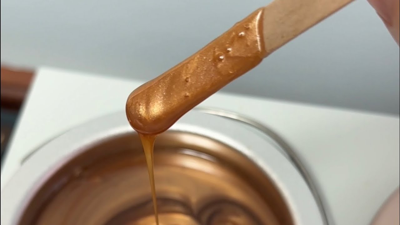 Professional waxing service on face chin and lip using honeycomb wax