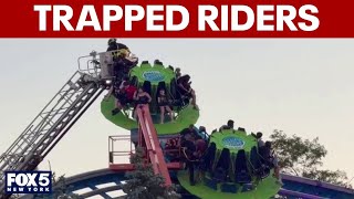 Firefighters working to save trapped riders at Adventureland
