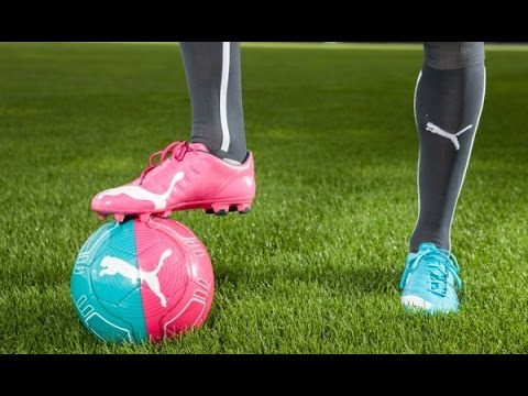 pink and blue soccer cleats puma