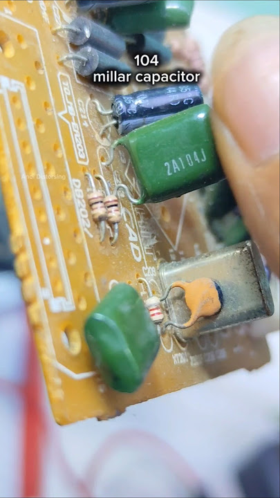 Mylar capacitors with codes on the body, one, zero, four #value #mylar #capacitor #education