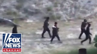 'Shocking' video shows armed cartel members scaling southern border