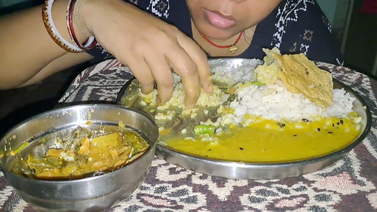 Eating Rice Daal With Alu Chokha Vindi Masala And Papad