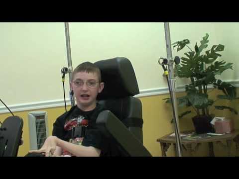 Young man with CP tries the Quadriciser