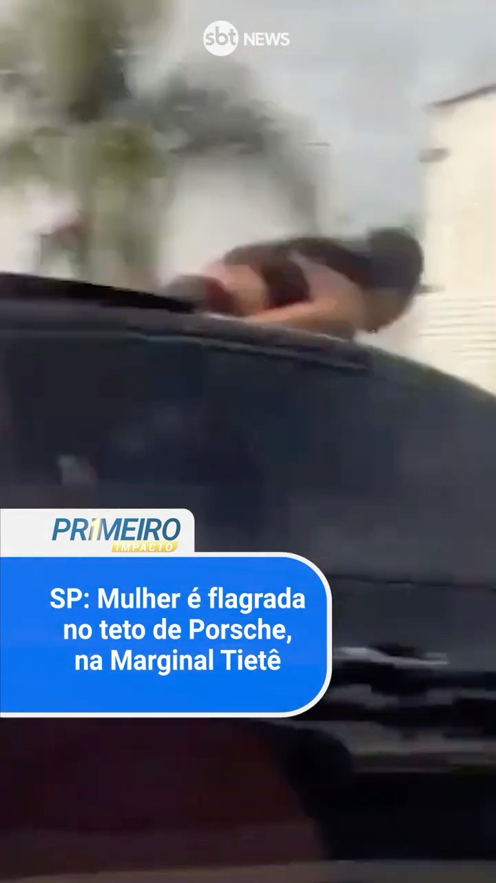 SP: Mulher é flagrada no teto de Porsche, no trânsito da Marginal Tietê