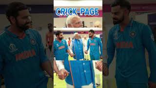 Prime Minister Narendra Modi engages with the Indian team following their defeat in the final.INDIA