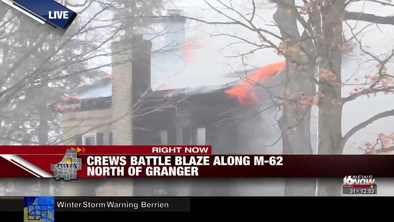 Crews battling house fire along M-62 just north of state line - YouTube