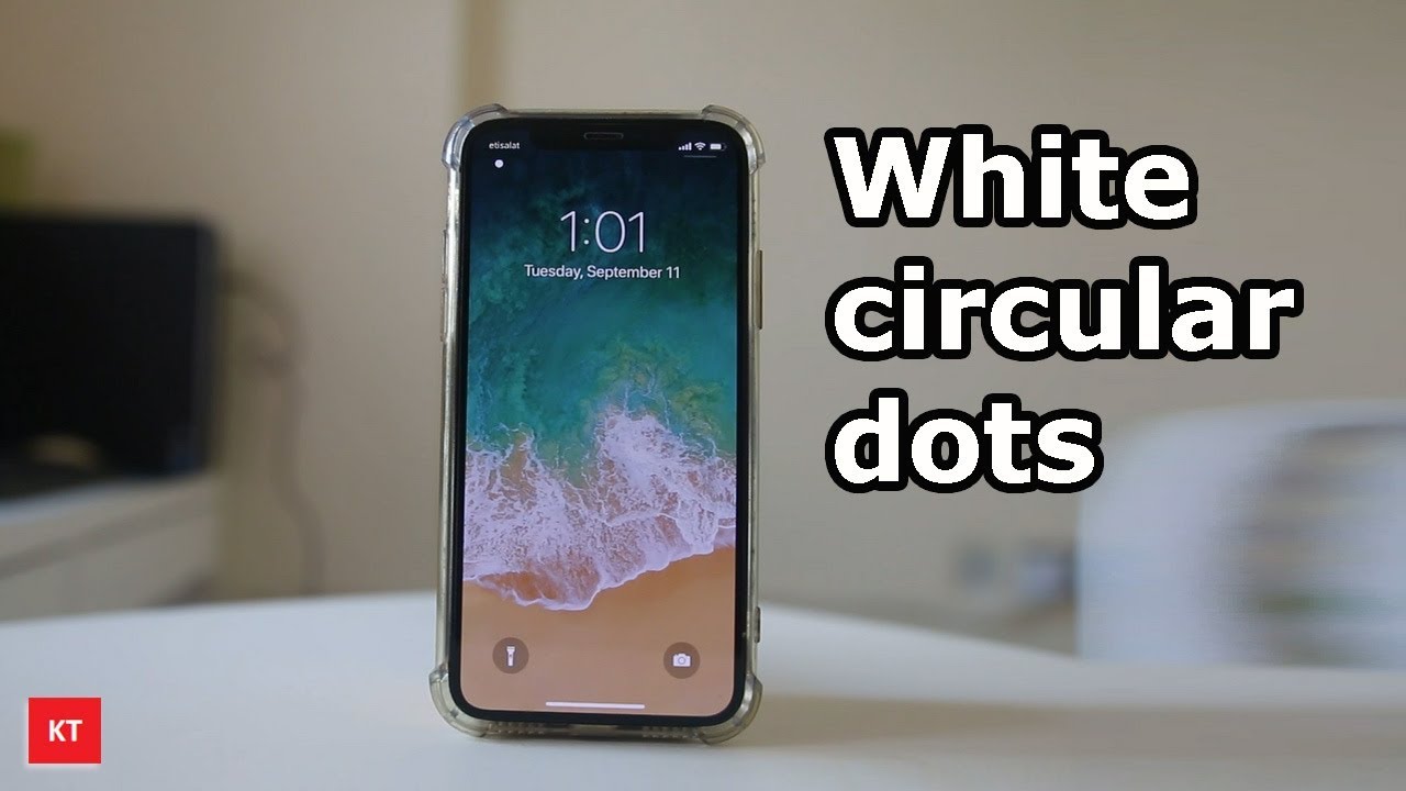 White Circular Dots On The Upper Left Corner Of The Iphone
