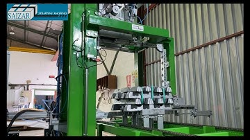 Automatic strapping machine for the strapping of lingot packages