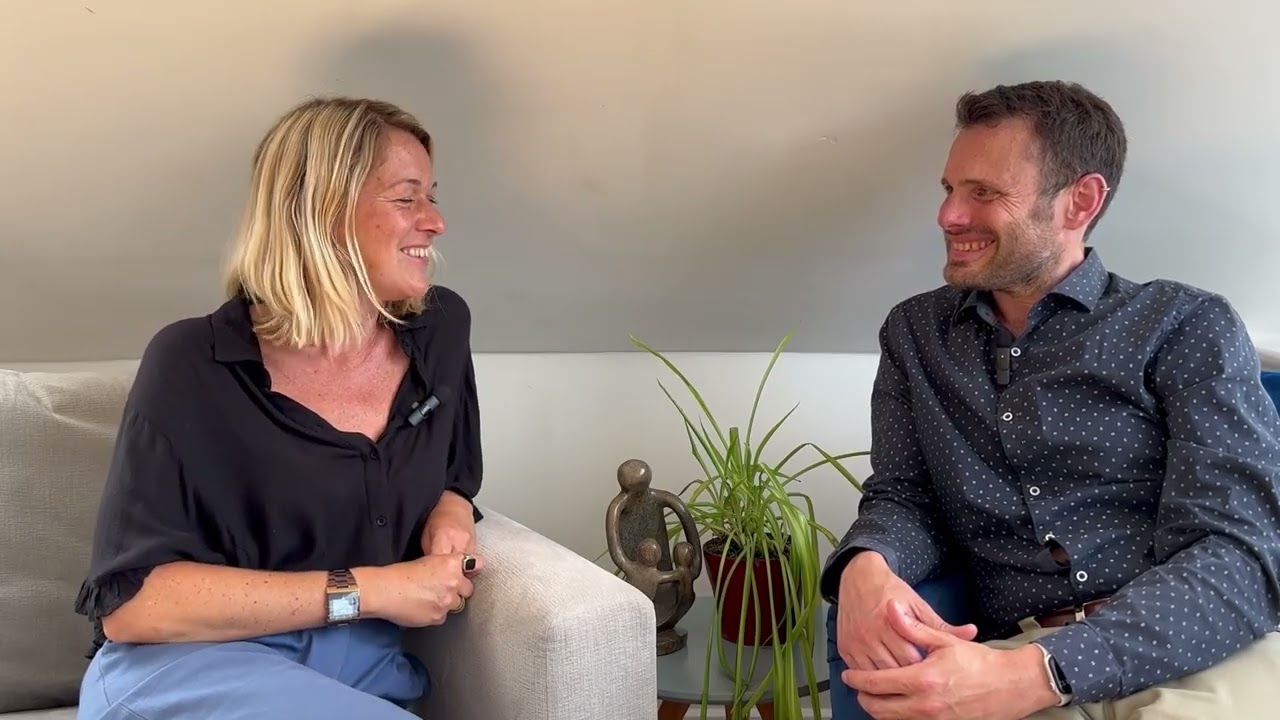 Two people discuss a care and wellbeing case study