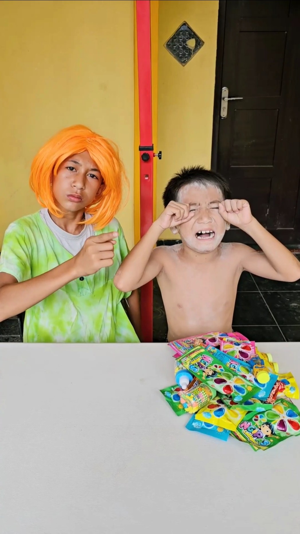 Crying, being hit by mom because of candy