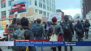 Students gather downtown to protest Betsy DeVos