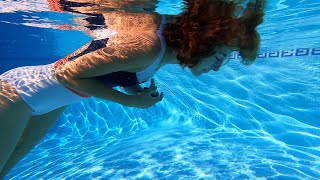 Carla Underwater - swimming with a white bathing suit