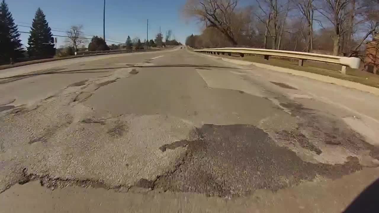 Pothole problems: Take a ride down 8 Mile with us - YouTube