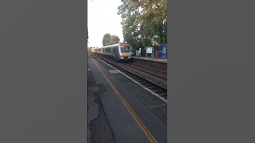 A chiltern railway 168 train flying through king sutton at speed going to london marleybone
